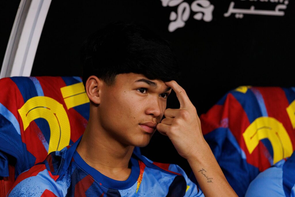 Dro sits on the bench while at FC Barcelona