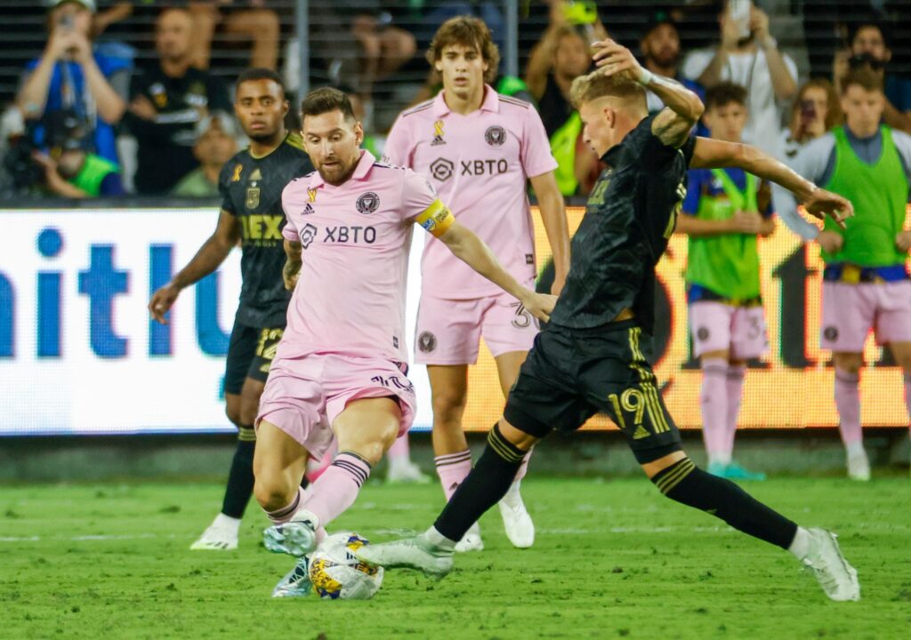 Inter Miami's Lionel Messi (L) in actions against Los Angeles FC's Mateusz Bogusz (R) during an MLS soccer match Sunday, Sept. 3, 2022, in Los Angeles.