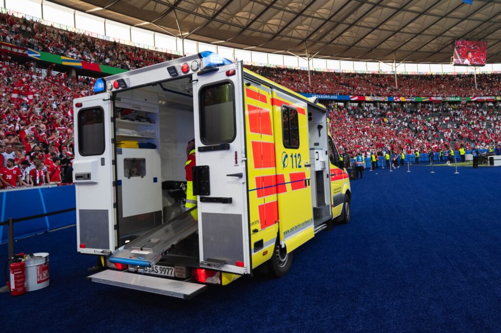 Ambulance takes footballer off pitch