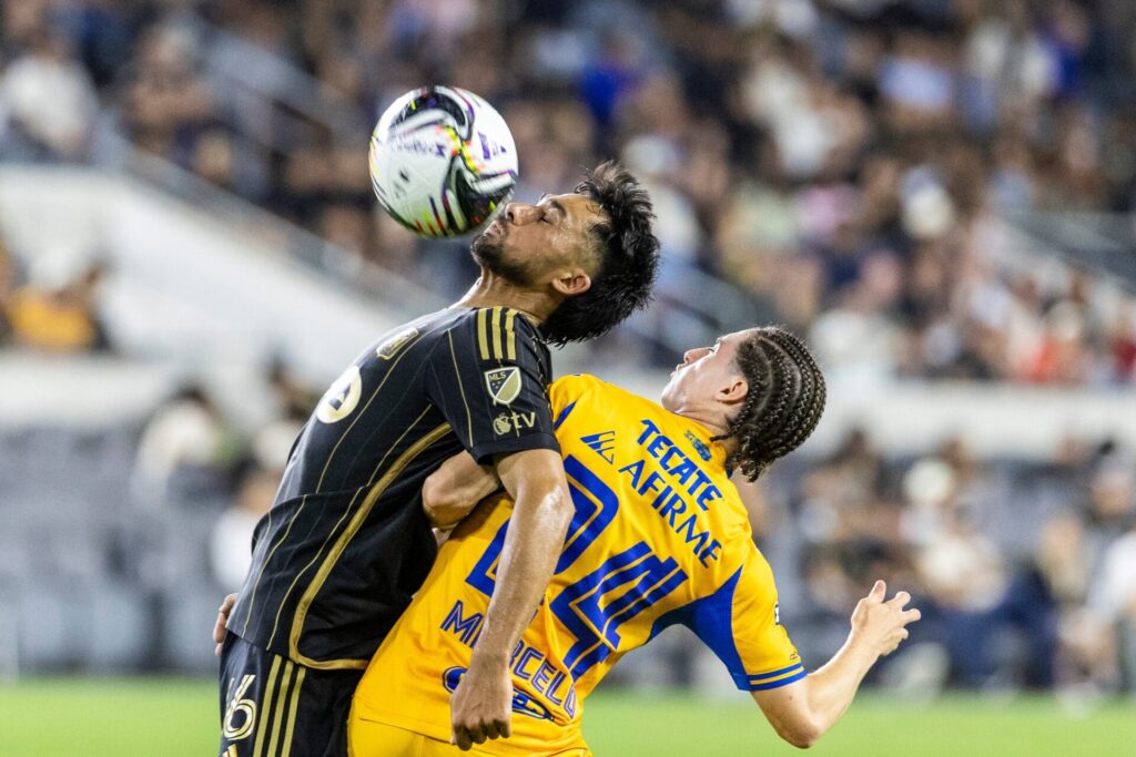 Los Angeles FC's Mathieu Choiniere #66 and Tigres’s Marcelo Flores #24 vie for the ball InLeagues Cup 2025 soccer match at BMO Stadium