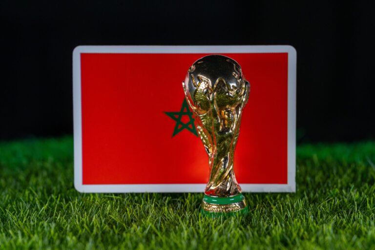 Morocco flag on grass with the World Cup trophy