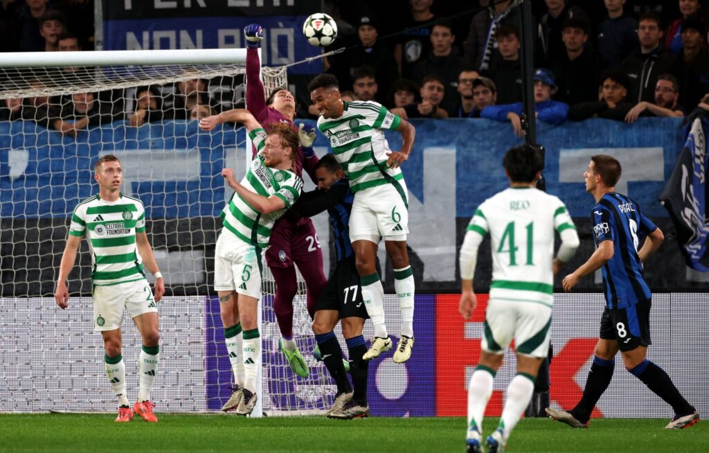 Auston Trusty jumps to win a header for Celtic