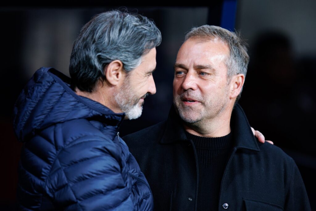 Osasuna head coach Vicente Moreno and Barcelona head coach Hansi Flick