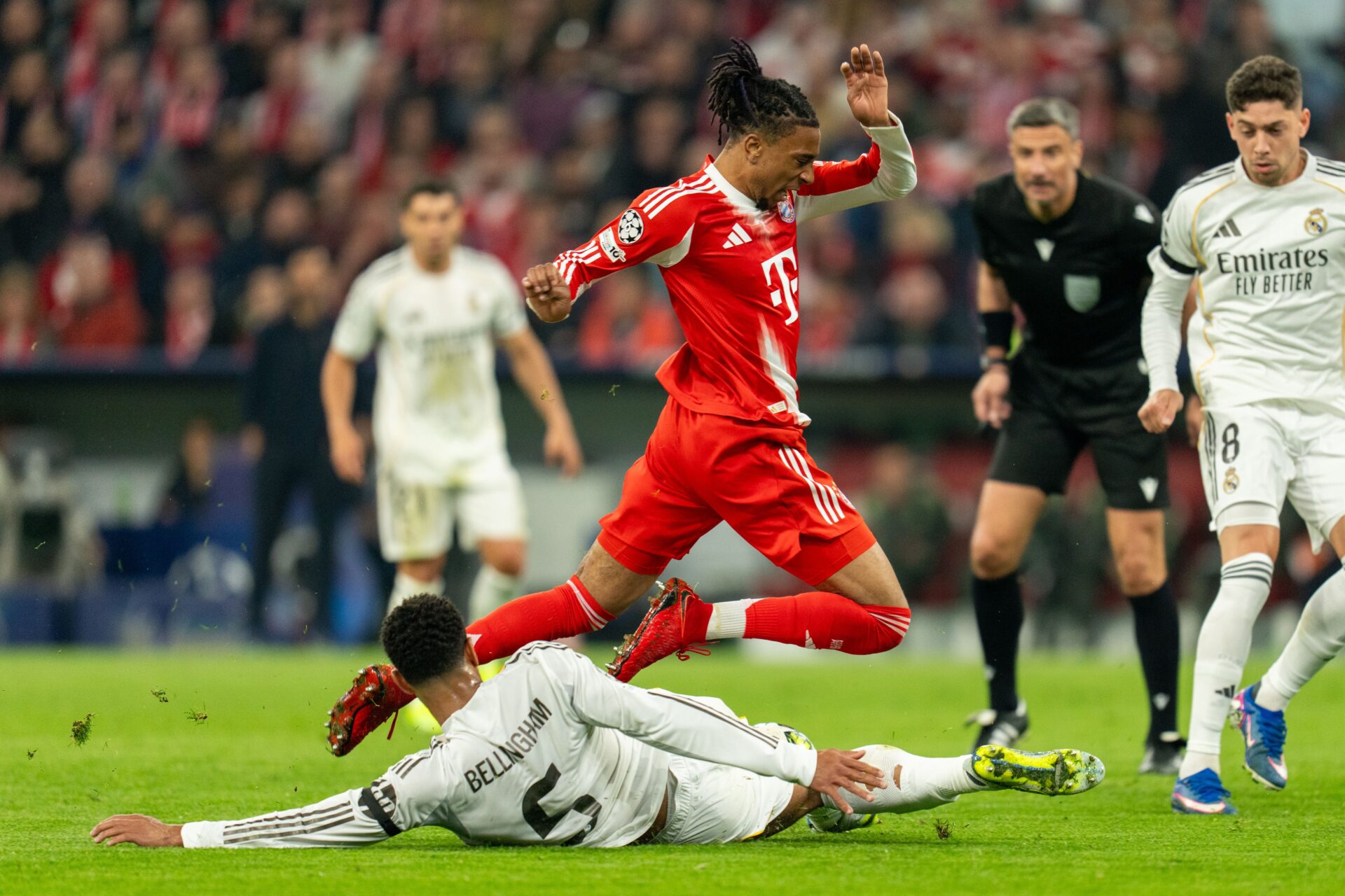 Michael Olise takes on Real Madrid's Jude Bellingham 